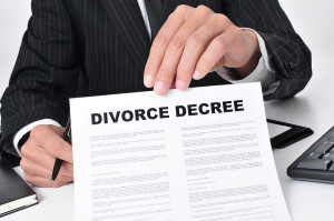 closeup of a lawyer sitting in his desk showing a divorce decree