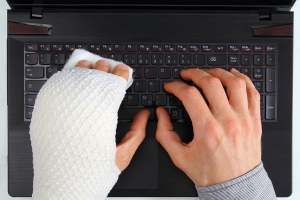 FMLA claim Employee typing with broken hand