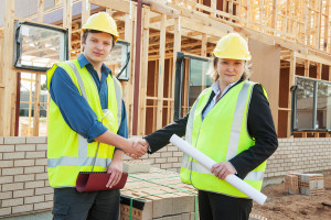 Construction workers reach handshake employment agreement