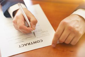 Lawyer signing employment agreement